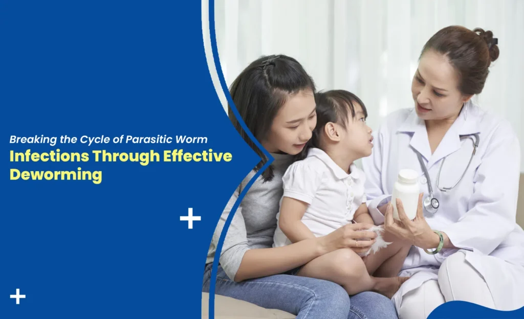 Doctor explaining deworming treatment to a mother and child to prevent parasitic worm infections.